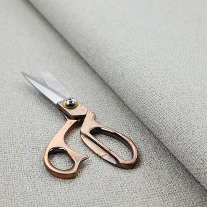 A light silver-grey or ash-grey fabric featuring a distinct, tightly woven grid texture. The material showcases a multi-tonal, basket-weave style pattern with blended cool grey and subtle pale threads, creating a clean, neutral, and matte finish across the entire surface.