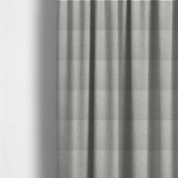 The fabric used to create these made-to-measure curtains is a light silver-grey or ash-grey fabric featuring a distinct, tightly woven grid texture. The material showcases a multi-tonal, basket-weave style pattern with blended cool grey and subtle pale threads, creating a clean, neutral, and matte finish across the entire surface.