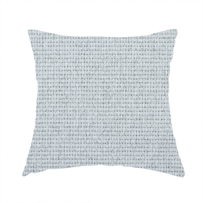 The fabric used to create this handmade cushion is a very light ice-grey or tinted white fabric featuring a distinct, tightly woven grid texture. The material showcases a multi-tonal, basket-weave style pattern with blended pale silver and crisp off-white threads, creating a bright, minimalist, and matte finish across the entire surface.