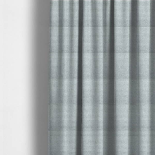 the fabric used to create these made-to-measure curtains is a very light ice-grey or tinted white fabric featuring a distinct, tightly woven grid texture. The material showcases a multi-tonal, basket-weave style pattern with blended pale silver and crisp off-white threads, creating a bright, minimalist, and matte finish across the entire surface.