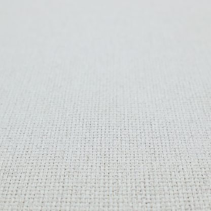 A light grey or soft ash fabric featuring a distinct, tightly woven grid texture. The material showcases a multi-tonal, basket-weave style pattern with blended pale grey and subtle white threads, creating a clean, neutral, and matte finish across the entire surface.