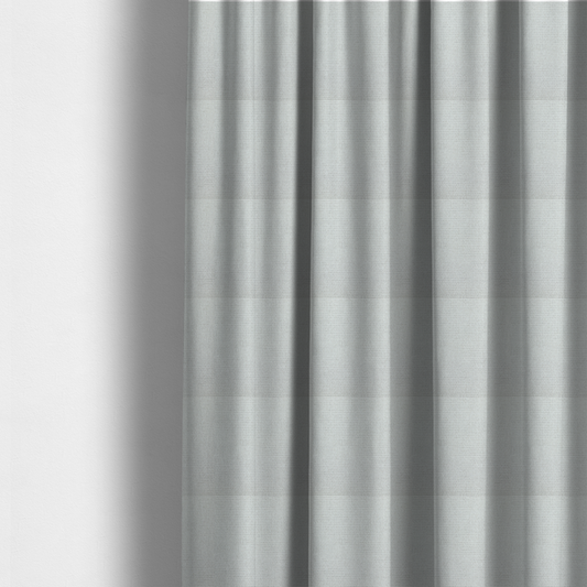 The fabric used to create these made-to-measure curtains is a light grey or soft ash fabric featuring a distinct, tightly woven grid texture. The material showcases a multi-tonal, basket-weave style pattern with blended pale grey and subtle white threads, creating a clean, neutral, and matte finish across the entire surface.