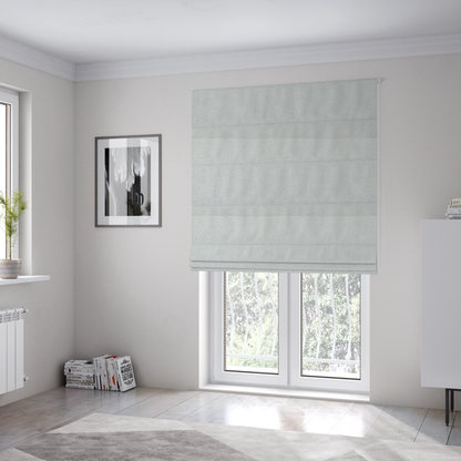 The fabric used to create these Roman blinds is a light grey or soft ash fabric featuring a distinct, tightly woven grid texture. The material showcases a multi-tonal, basket-weave style pattern with blended pale grey and subtle white threads, creating a clean, neutral, and matte finish across the entire surface.