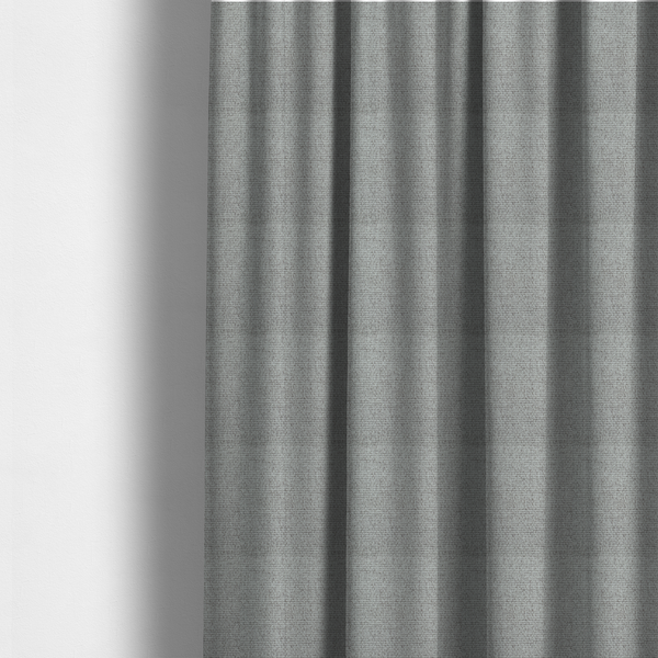The fabric used to create these made-to-measure curtains is a mid-grey or stone-grey fabric featuring a distinct, tightly woven grid texture. The material showcases a multi-tonal, basket-weave style pattern with blended cool grey, taupe, and subtle white threads, creating a grounded, textured neutral, and matte finish across the entire surface.