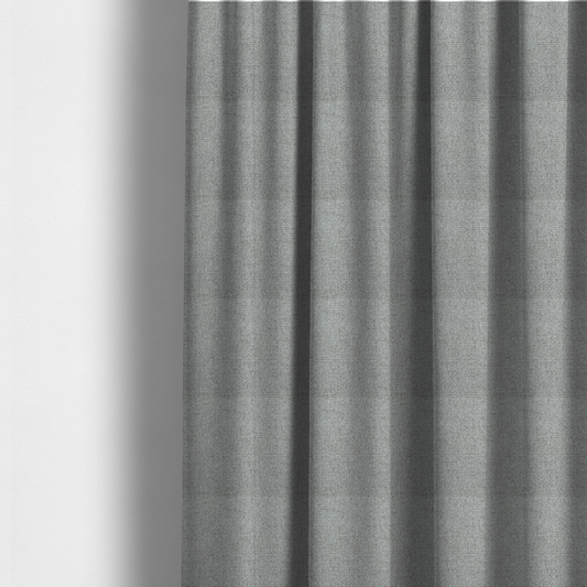 The fabric used to create these made-to-measure curtains is a mid-grey or stone-grey fabric featuring a distinct, tightly woven grid texture. The material showcases a multi-tonal, basket-weave style pattern with blended cool grey, taupe, and subtle white threads, creating a grounded, textured neutral, and matte finish across the entire surface.