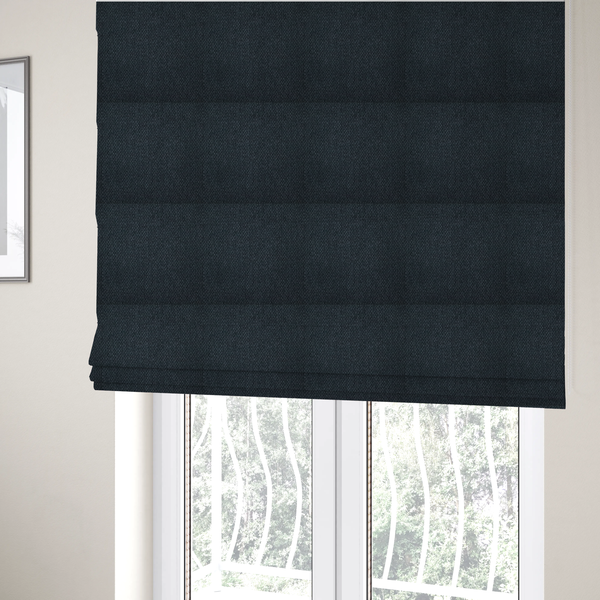 The fabric used to create these Roman blinds is a dark charcoal-grey or slate fabric featuring a distinct, tightly woven grid texture. The material showcases a rich, multi-tonal, basket-weave style pattern with blended deep grey, subtle navy, and black threads, creating a moody, sophisticated, and matte finish across the entire surface.