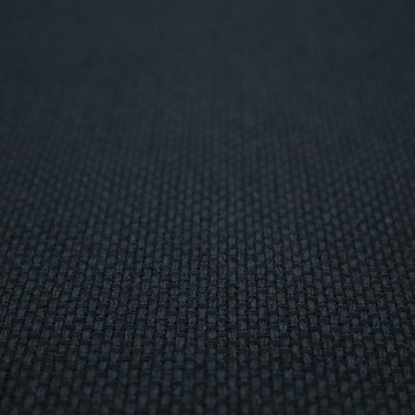 A deep midnight-black or ink-black fabric featuring a distinct, tightly woven grid texture. The material showcases a rich, multi-tonal, basket-weave style pattern with interlaced charcoal and solid black threads, creating a dramatic, subtle, and matte finish across the entire surface.