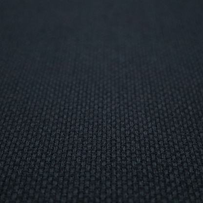 A deep midnight-black or ink-black fabric featuring a distinct, tightly woven grid texture. The material showcases a rich, multi-tonal, basket-weave style pattern with interlaced charcoal and solid black threads, creating a dramatic, subtle, and matte finish across the entire surface.