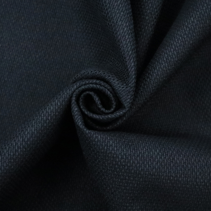 A deep midnight-black or ink-black fabric featuring a distinct, tightly woven grid texture. The material showcases a rich, multi-tonal, basket-weave style pattern with interlaced charcoal and solid black threads, creating a dramatic, subtle, and matte finish across the entire surface.