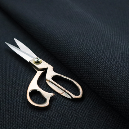 A deep midnight-black or ink-black fabric featuring a distinct, tightly woven grid texture. The material showcases a rich, multi-tonal, basket-weave style pattern with interlaced charcoal and solid black threads, creating a dramatic, subtle, and matte finish across the entire surface.