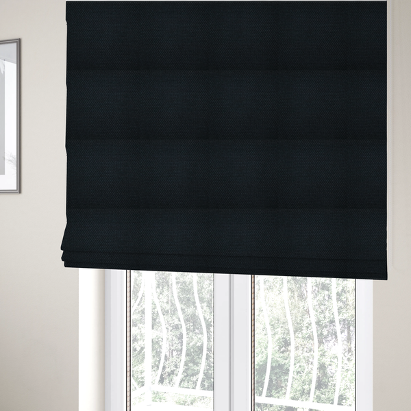 The fabric used to create these Roman blinds is a deep midnight-black or ink-black fabric featuring a distinct, tightly woven grid texture. The material showcases a rich, multi-tonal, basket-weave style pattern with interlaced charcoal and solid black threads, creating a dramatic, subtle, and matte finish across the entire surface.