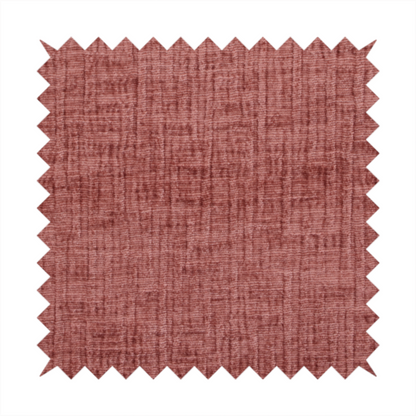 A textured upholstery fabric in a dusty rose or terracotta pink colour. The fabric features a raised, cross-hatched slub texture with subtle vertical and horizontal ridges, giving it a cosy, slightly distressed chenille appearance.