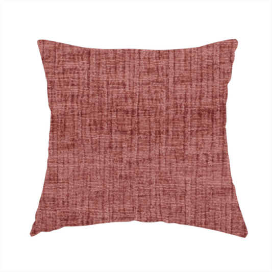 The fabric used to create this handmade cushion is a textured upholstery fabric in a dusty rose or terracotta pink colour. The fabric features a raised, cross-hatched slub texture with subtle vertical and horizontal ridges, giving it a cosy, slightly distressed chenille appearance.