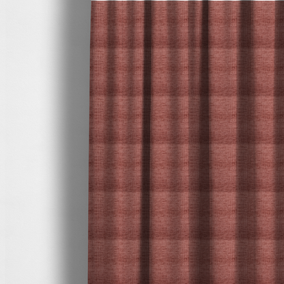 The fabric used to create these made-to-measure curtains is a textured upholstery fabric in a dusty rose or terracotta pink colour. The fabric features a raised, cross-hatched slub texture with subtle vertical and horizontal ridges, giving it a cosy, slightly distressed chenille appearance.