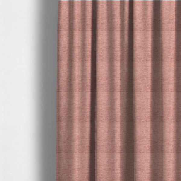 The fabric used to create these made-to-measure curtains is a textured upholstery fabric in a soft, light blush pink shade. The material features a distinctive cross-hatched slub texture with fine vertical and horizontal ridges, creating a plush, tactile chenille finish.