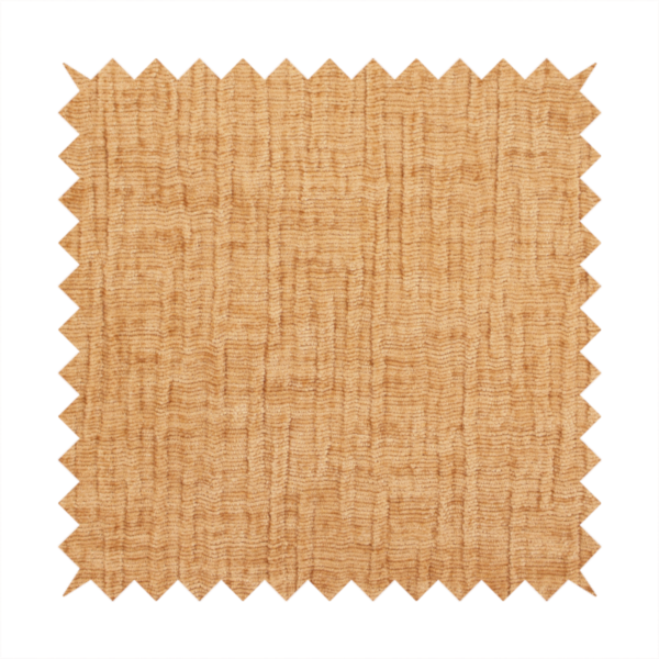 A textured upholstery fabric in a warm, honey-gold or mustard yellow colour. The material features a distinct cross-hatched slub texture with subtle vertical and horizontal ridges, creating a soft, dimensional chenille finish.