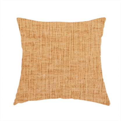The fabric used to create this handmade cushion is a textured upholstery fabric in a warm, honey-gold or mustard yellow colour. The material features a distinct cross-hatched slub texture with subtle vertical and horizontal ridges, creating a soft, dimensional chenille finish.