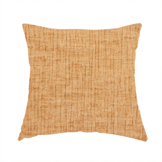 The fabric used to create this handmade cushion is a textured upholstery fabric in a warm, honey-gold or mustard yellow colour. The material features a distinct cross-hatched slub texture with subtle vertical and horizontal ridges, creating a soft, dimensional chenille finish.