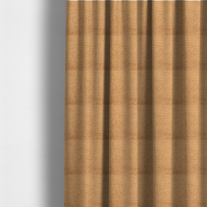 The fabric used to create these made-to-measure curtains is a textured upholstery fabric in a warm, honey-gold or mustard yellow colour. The material features a distinct cross-hatched slub texture with subtle vertical and horizontal ridges, creating a soft, dimensional chenille finish.