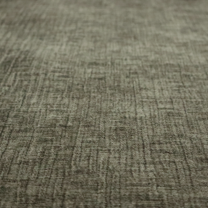 A textured upholstery fabric in an earthy olive or sage green colour. The material features a prominent cross-hatched slub texture with subtle horizontal and vertical ridges, giving it a cosy, multi-dimensional chenille appearance.