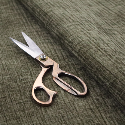 A textured upholstery fabric in an earthy olive or sage green colour. The material features a prominent cross-hatched slub texture with subtle horizontal and vertical ridges, giving it a cosy, multi-dimensional chenille appearance.