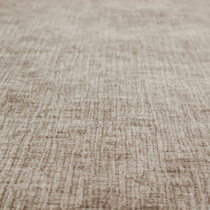 A textured upholstery fabric in a neutral taupe or greige colour. The material features a distinctive cross-hatched slub texture with subtle vertical and horizontal ridges, creating a soft, dimensional chenille finish.