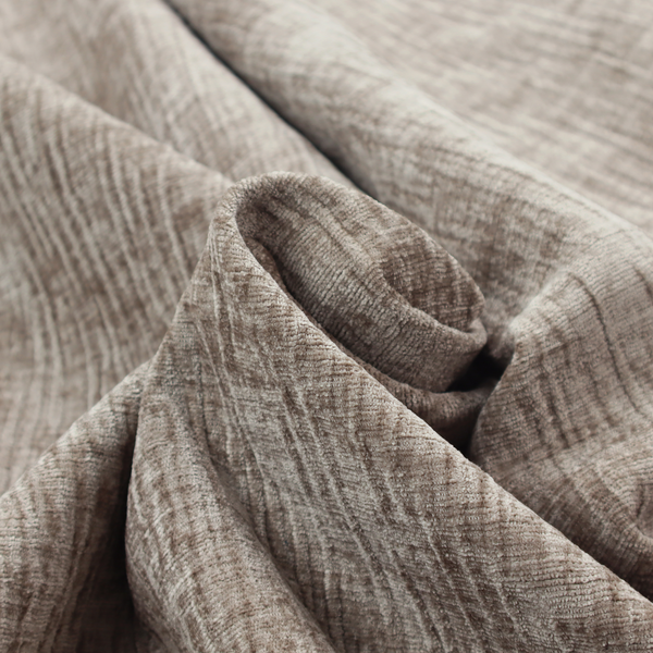 A textured upholstery fabric in a neutral taupe or greige colour. The material features a distinctive cross-hatched slub texture with subtle vertical and horizontal ridges, creating a soft, dimensional chenille finish.