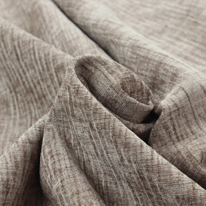 A textured upholstery fabric in a neutral taupe or greige colour. The material features a distinctive cross-hatched slub texture with subtle vertical and horizontal ridges, creating a soft, dimensional chenille finish.