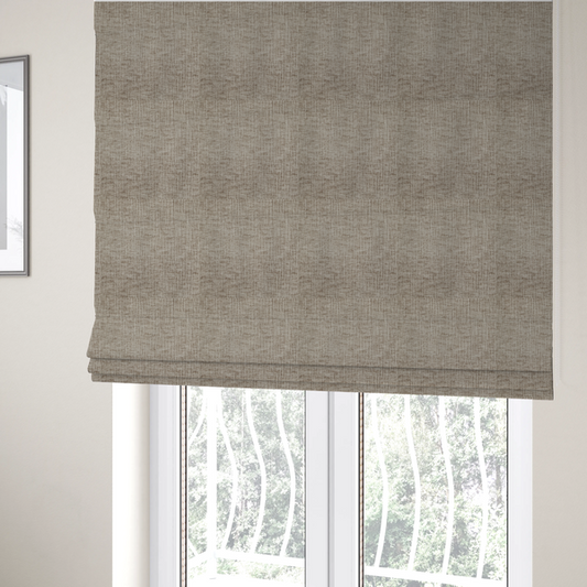 The fabric used to create these Roman blinds is a textured upholstery fabric in a neutral taupe or greige colour. The material features a distinctive cross-hatched slub texture with subtle vertical and horizontal ridges, creating a soft, dimensional chenille finish.