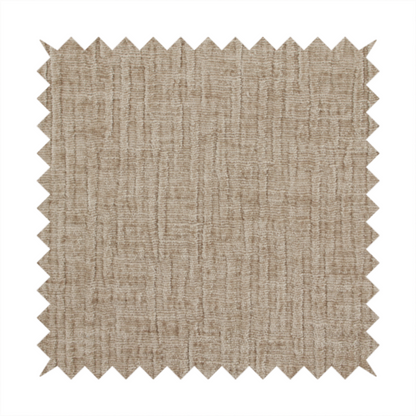 A textured upholstery fabric in a warm, neutral beige or oatmeal colour. The material features a distinct cross-hatched slub texture with fine vertical and horizontal ridges, creating a soft, dimensional chenille finish.