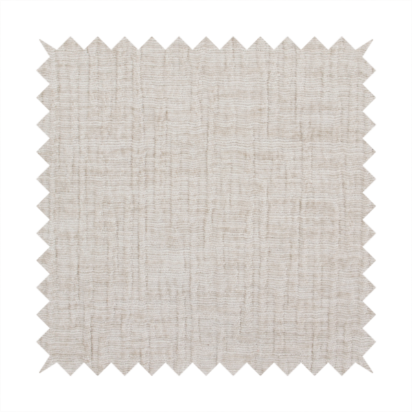 A textured upholstery fabric in a light cream or ivory colour. The material features a subtle cross-hatched slub texture with fine vertical and horizontal ridges, creating a soft, dimensional chenille finish.