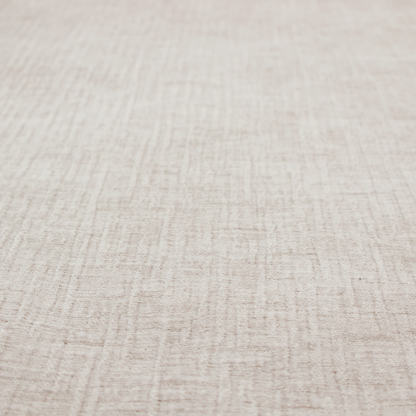 A textured upholstery fabric in a light cream or ivory colour. The material features a subtle cross-hatched slub texture with fine vertical and horizontal ridges, creating a soft, dimensional chenille finish.