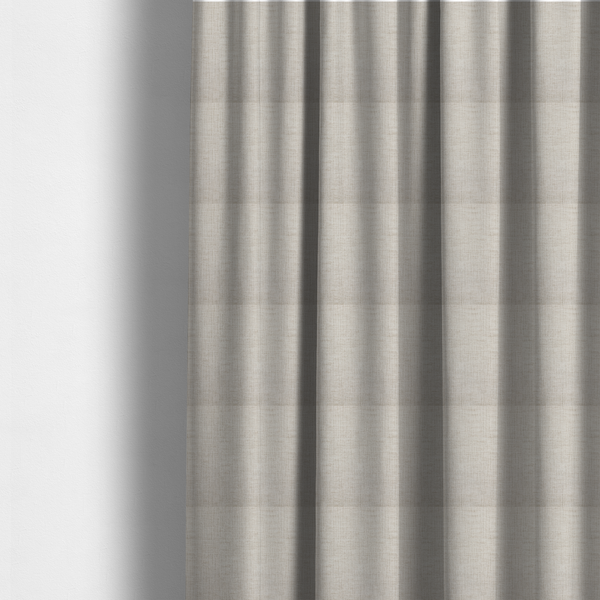 The fabric used to create these made-to-measure curtains is a textured upholstery fabric in a light cream or ivory colour. The material features a subtle cross-hatched slub texture with fine vertical and horizontal ridges, creating a soft, dimensional chenille finish.