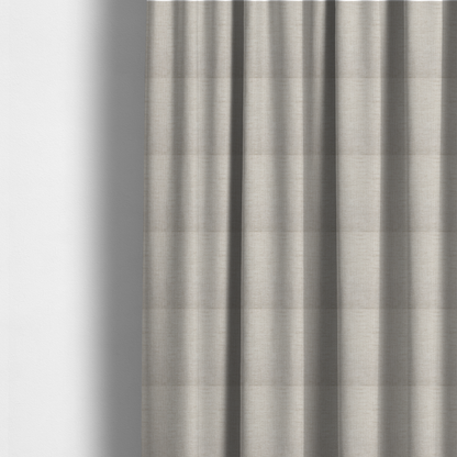 The fabric used to create these made-to-measure curtains is a textured upholstery fabric in a light cream or ivory colour. The material features a subtle cross-hatched slub texture with fine vertical and horizontal ridges, creating a soft, dimensional chenille finish.
