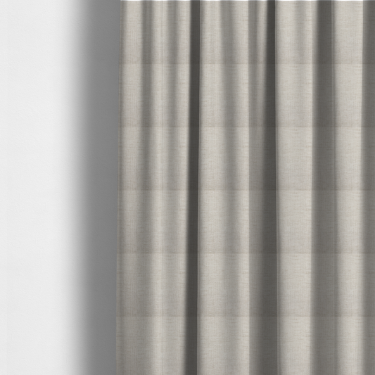 The fabric used to create these made-to-measure curtains is a textured upholstery fabric in a light cream or ivory colour. The material features a subtle cross-hatched slub texture with fine vertical and horizontal ridges, creating a soft, dimensional chenille finish.