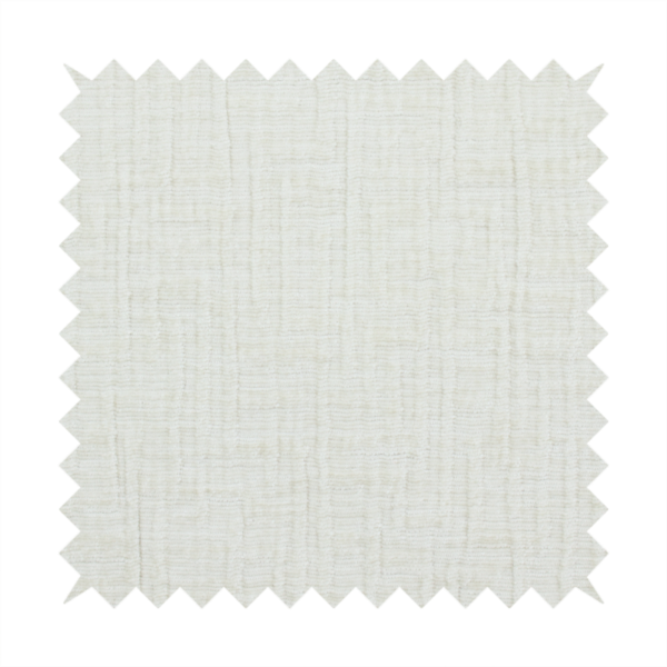 A textured upholstery fabric in a clean white or light ivory colour. The material features a subtle cross-hatched slub texture with fine vertical and horizontal ridges, creating a soft, dimensional chenille finish.