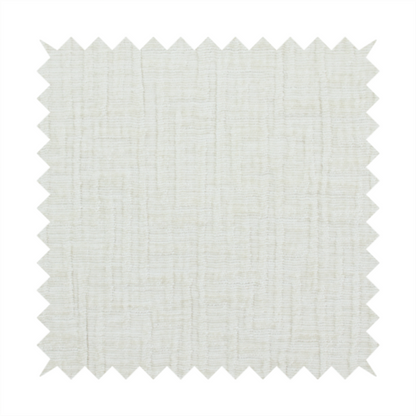 A textured upholstery fabric in a clean white or light ivory colour. The material features a subtle cross-hatched slub texture with fine vertical and horizontal ridges, creating a soft, dimensional chenille finish.