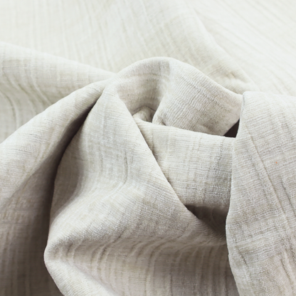 A textured upholstery fabric in a clean white or light ivory colour. The material features a subtle cross-hatched slub texture with fine vertical and horizontal ridges, creating a soft, dimensional chenille finish.