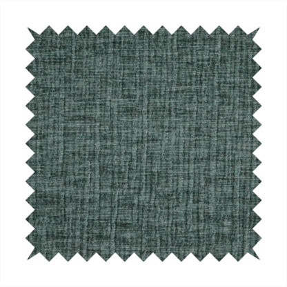 A textured upholstery fabric in a deep teal or eucalyptus green colour. The material features a distinct cross-hatched slub texture with subtle vertical and horizontal ridges, creating a soft, dimensional chenille finish.