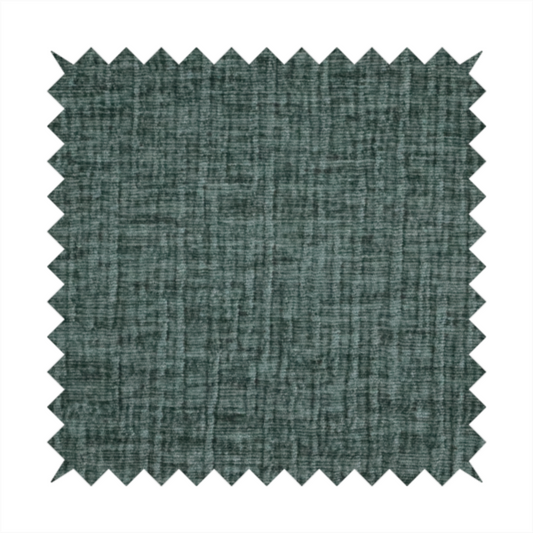 A textured upholstery fabric in a deep teal or eucalyptus green colour. The material features a distinct cross-hatched slub texture with subtle vertical and horizontal ridges, creating a soft, dimensional chenille finish.