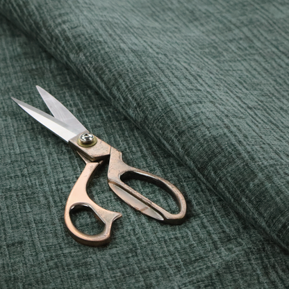 A textured upholstery fabric in a deep teal or eucalyptus green colour. The material features a distinct cross-hatched slub texture with subtle vertical and horizontal ridges, creating a soft, dimensional chenille finish.