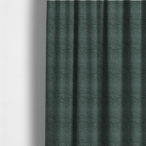 The fabric used to create these made-to-measure curtains is a textured upholstery fabric in a deep teal or eucalyptus green colour. The material features a distinct cross-hatched slub texture with subtle vertical and horizontal ridges, creating a soft, dimensional chenille finish.