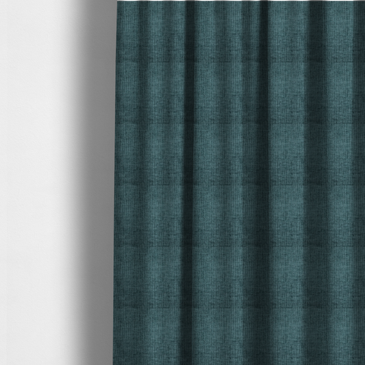 The fabric used to create these made-to-measure curtains is a textured upholstery fabric in a vibrant peacock blue or deep teal shade. The material features a distinct cross-hatched slub texture with prominent vertical and fine horizontal ridges, creating a soft, dimensional chenille finish.