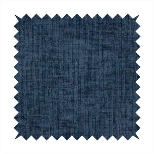 A textured upholstery fabric in a deep navy or midnight blue shade. The material features a distinct cross-hatched slub texture with prominent vertical and fine horizontal ridges, creating a soft, dimensional chenille finish.