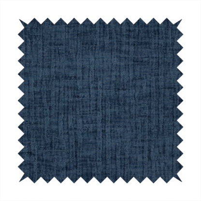 A textured upholstery fabric in a deep navy or midnight blue shade. The material features a distinct cross-hatched slub texture with prominent vertical and fine horizontal ridges, creating a soft, dimensional chenille finish.