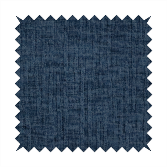 A textured upholstery fabric in a deep navy or midnight blue shade. The material features a distinct cross-hatched slub texture with prominent vertical and fine horizontal ridges, creating a soft, dimensional chenille finish.