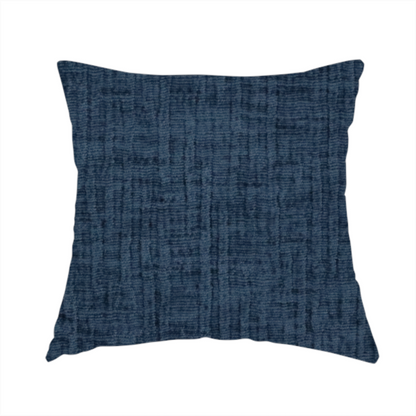 The fabric used to create this handmade cushion is a textured upholstery fabric in a deep navy or midnight blue shade. The material features a distinct cross-hatched slub texture with prominent vertical and fine horizontal ridges, creating a soft, dimensional chenille finish.