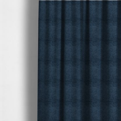 The fabric used to create these made-to-measure curtains is a textured upholstery fabric in a deep navy or midnight blue shade. The material features a distinct cross-hatched slub texture with prominent vertical and fine horizontal ridges, creating a soft, dimensional chenille finish.