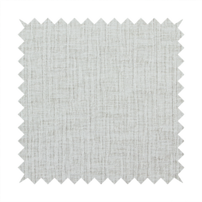 A textured upholstery fabric in a light silver or pale grey colour. The material features a subtle cross-hatched slub texture with fine vertical and horizontal ridges, creating a soft, dimensional chenille finish.