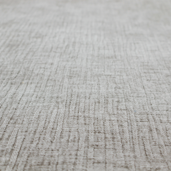 A textured upholstery fabric in a mid-tone grey or pebble shade. The material features a distinct cross-hatched slub texture with prominent vertical and fine horizontal ridges, creating a soft, dimensional chenille finish.